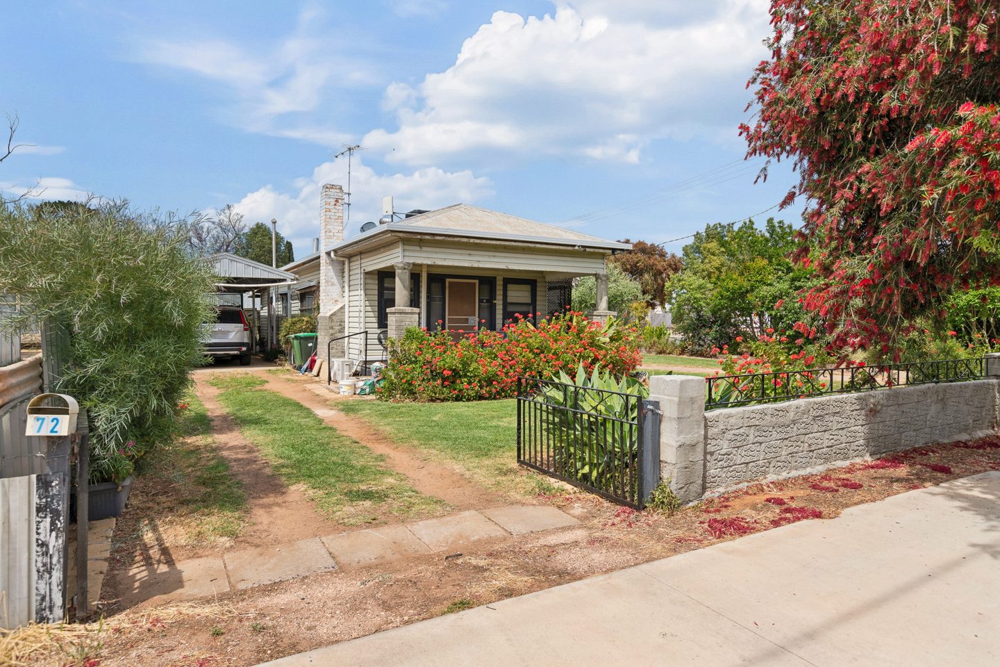 Street view of the home and driveway