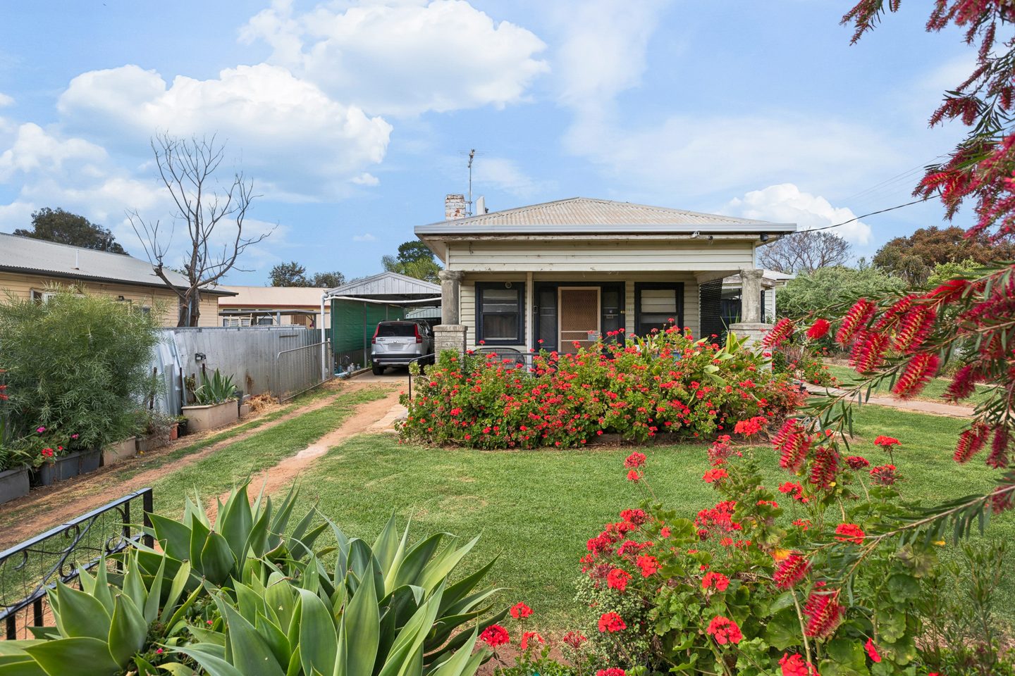 Flowering front garden and sheltered porch at 72 Tapio Street