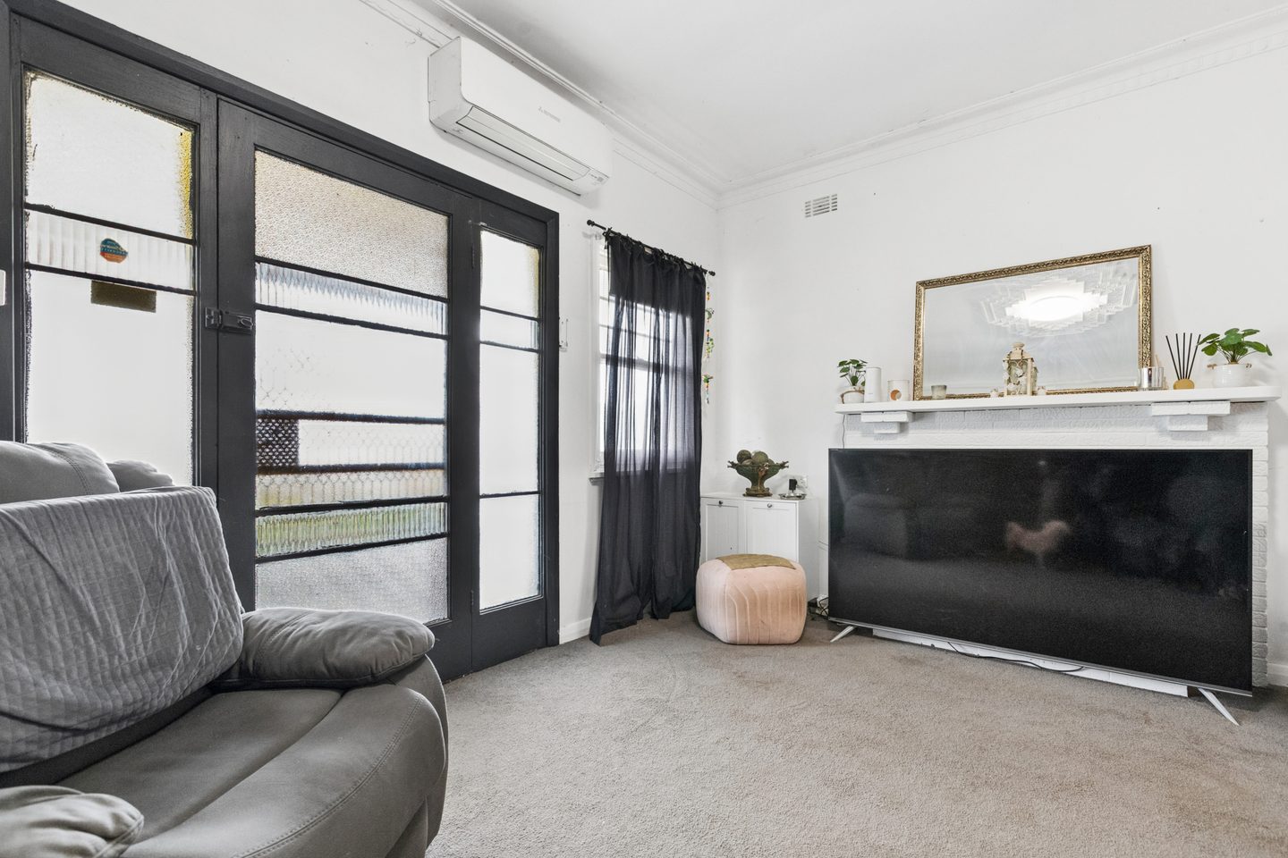 Textured-glass entrance, mantel and split-system air conditioning