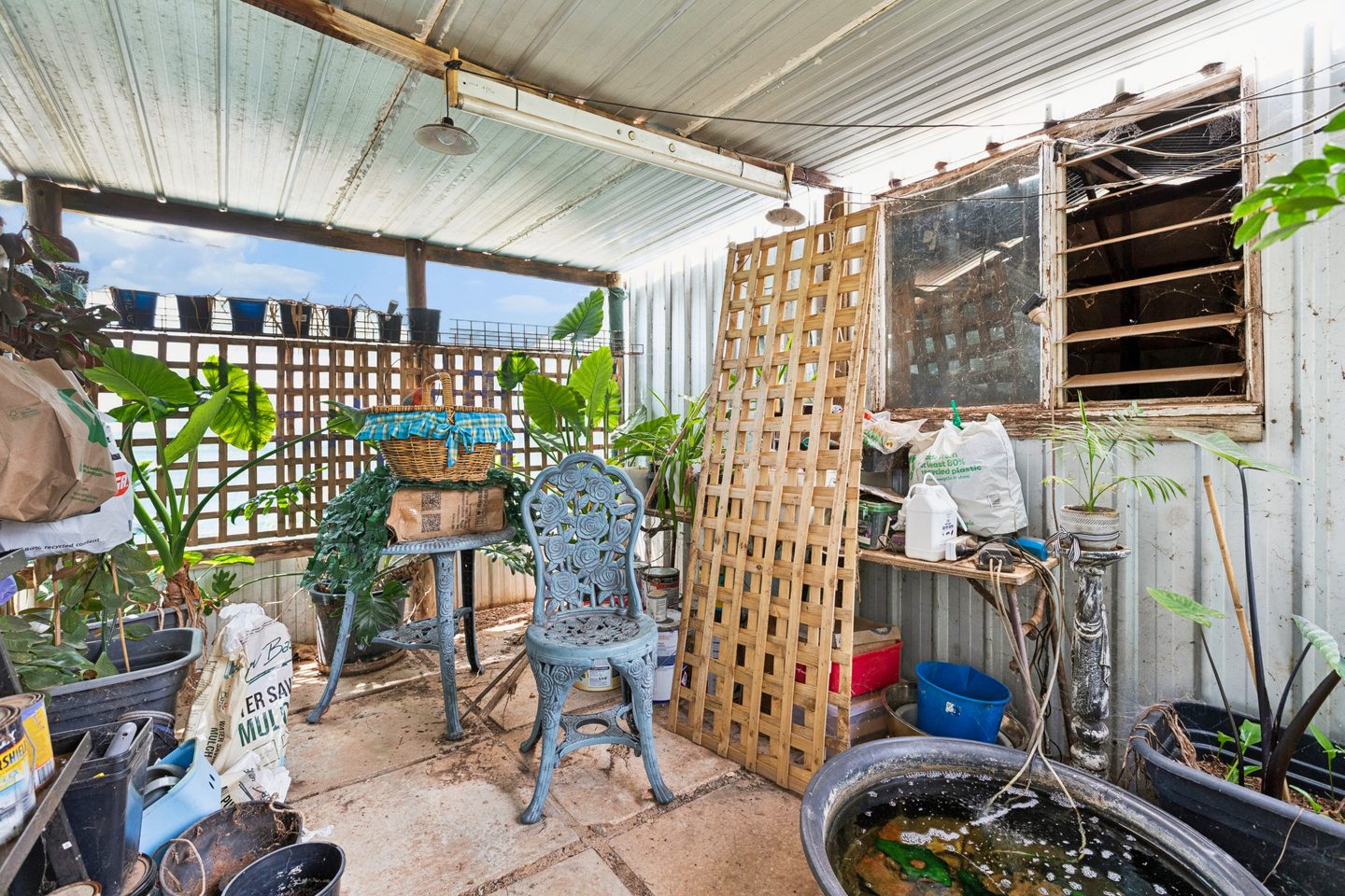 Sheltered outdoor area beside the house