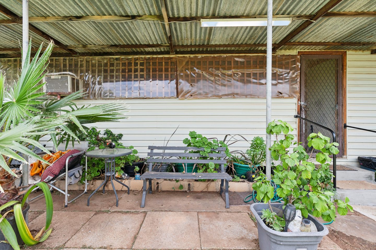 Covered patio beside the home