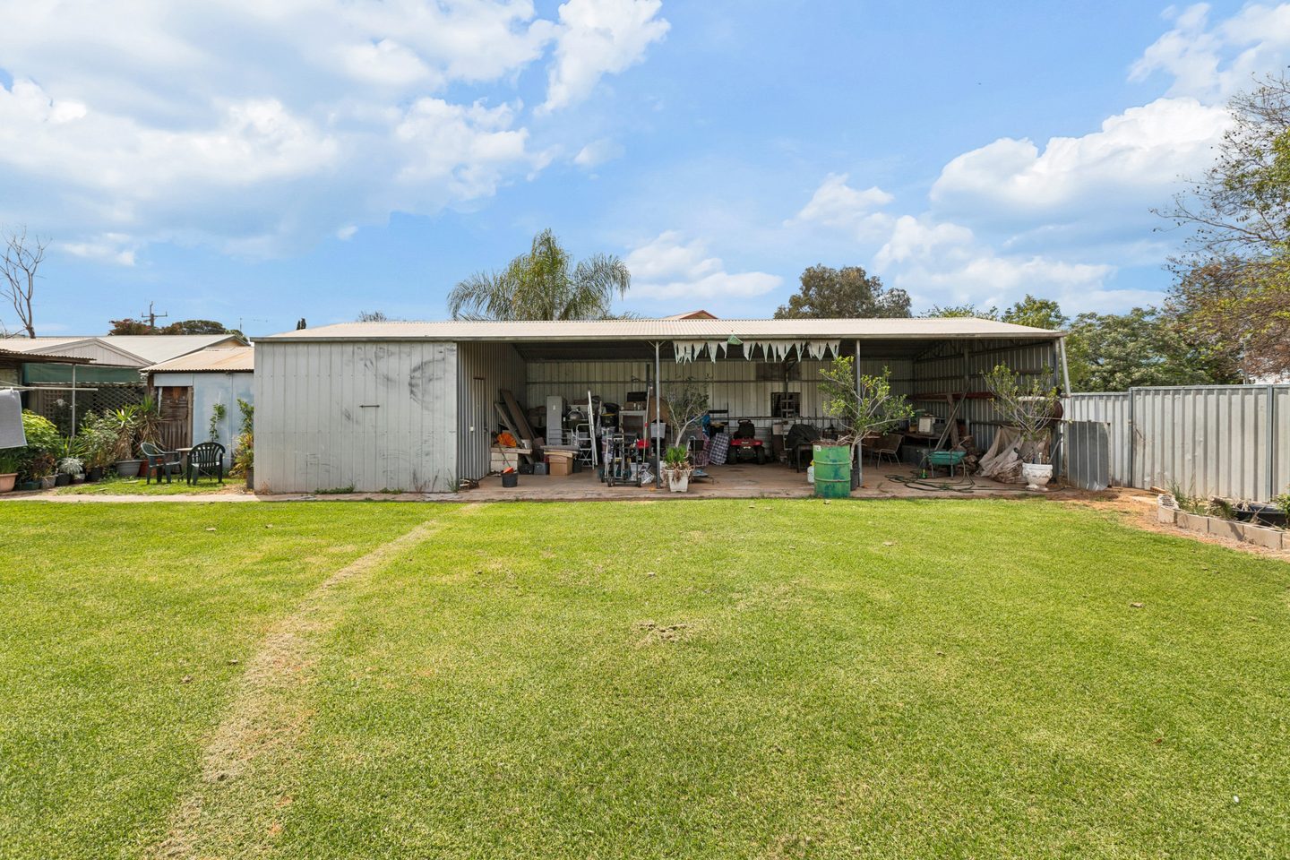 Shedding and covered area facing the back lawn